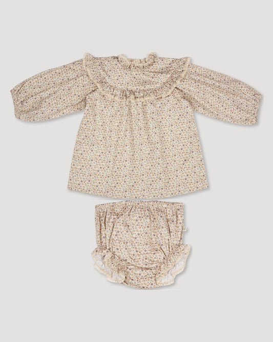 Early Sunday, Charlie Baby Dress & Bloomer Set in Mini Flowers print, made from Printed 60s Cotton Satin fabric, featuring long sleeves with rufflled lace & matching bloomers, shown in a back flat-lay view