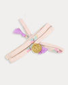 Early Sunday, Charm Bracelet in Butterflies print, made from Printed Cotton Tiny Swiss Dobby fabric, featuring a soft fabric bracelet design with a charm, shown in an angled view with a close-up shot