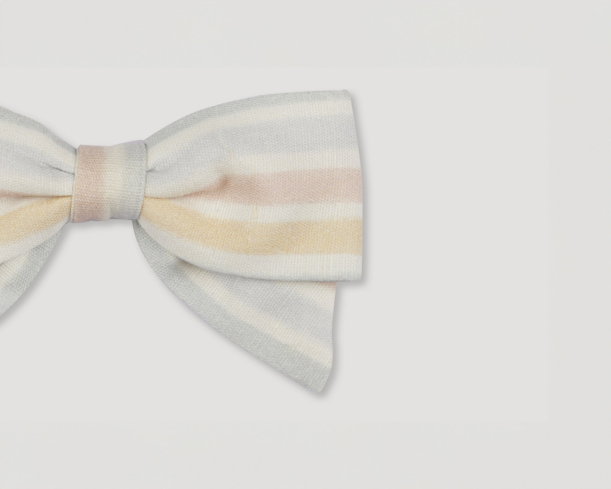 Early Sunday, Chiara Alligator Clip in Mini Flower print, made from Printed canvas 70% Cotton 30% Linen fabric, featuring a bow design on an alligator clip with a secure fit, shown in a closeup flat-lay view