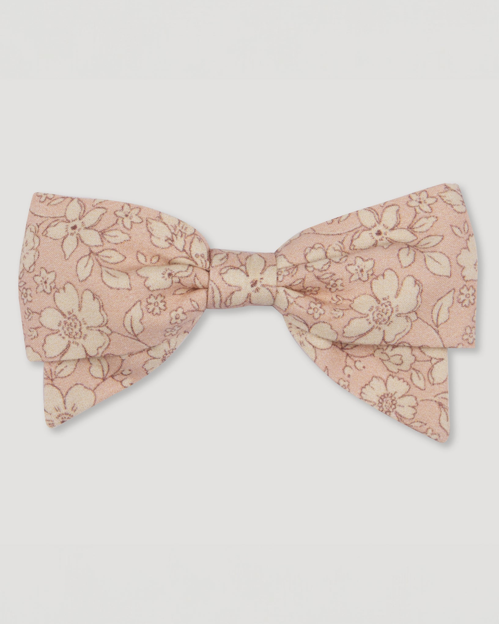 Early Sunday, Chiara Alligator Clip in Garden Flowers print, made from Printed Cotton Cambric fabric, featuring a bow design on an alligator clip with a secure fit, shown in a front flat-lay view