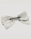 Early Sunday, Chiara Alligator Clip in Mini Flower print, made from Printed Cotton Cambric fabric, featuring a bow design on an alligator clip with a secure fit, shown in a back flat-lay view