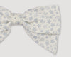 Early Sunday, Chiara Alligator Clip in Mini Flower print, made from Printed Cotton Cambric fabric, featuring a bow design on an alligator clip with a secure fit, shown in a closeup flat-lay view