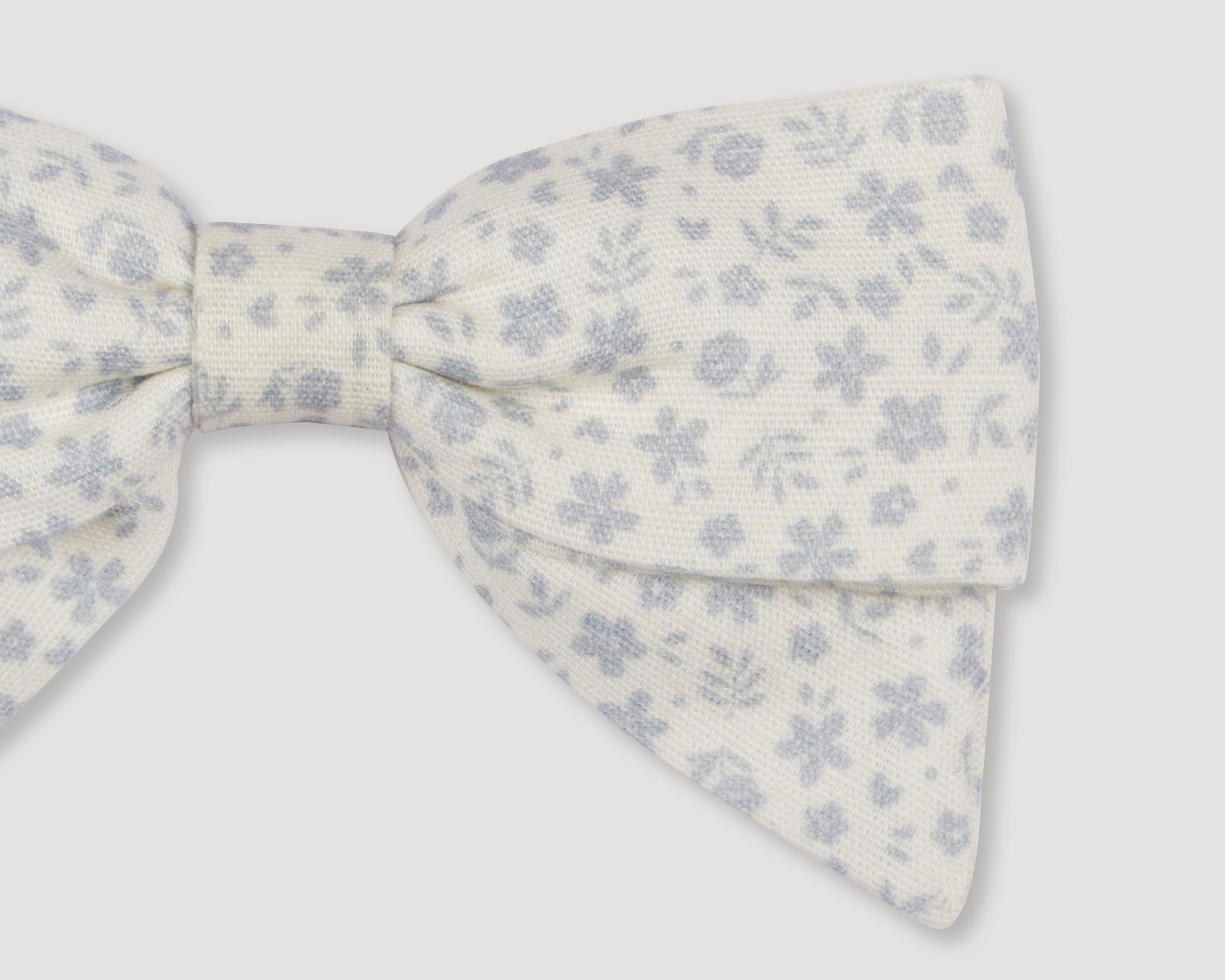Early Sunday, Chiara Alligator Clip in Mini Flower print, made from Printed Cotton Cambric fabric, featuring a bow design on an alligator clip with a secure fit, shown in a closeup flat-lay view