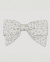 Early Sunday, Chiara Alligator Clip in Mini Flower print, made from Printed Cotton Cambric fabric, featuring a bow design on an alligator clip with a secure fit, shown in a front flat-lay view