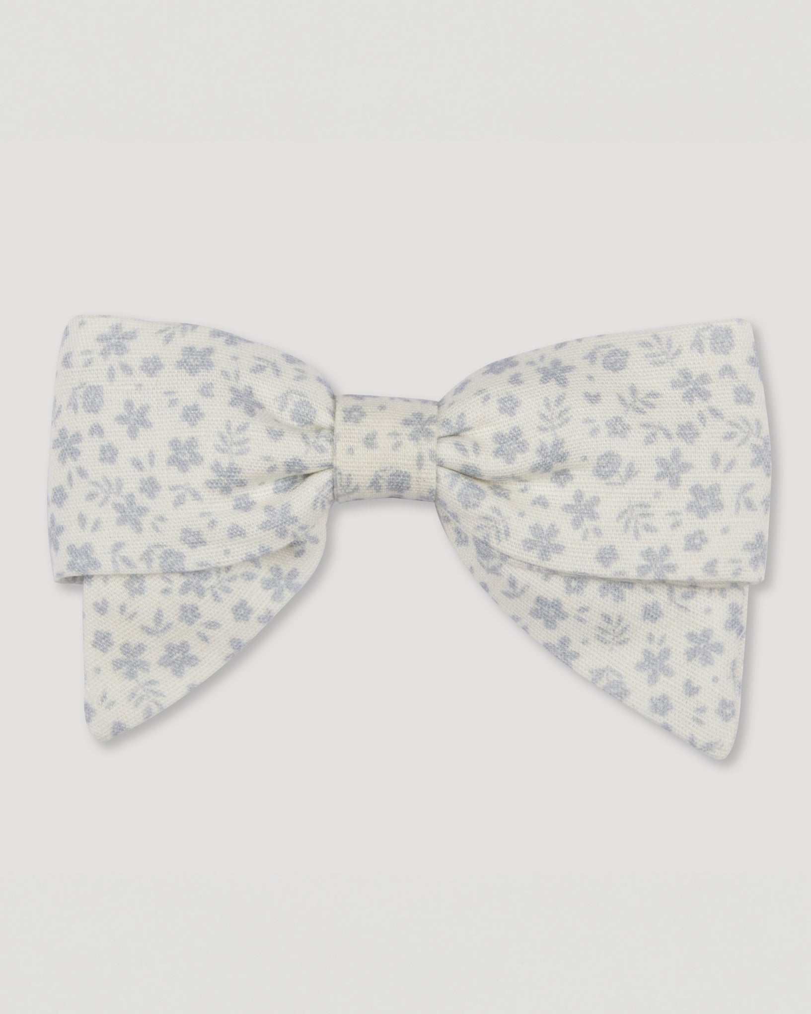 Early Sunday, Chiara Alligator Clip in Mini Flower print, made from Printed Cotton Cambric fabric, featuring a bow design on an alligator clip with a secure fit, shown in a front flat-lay view