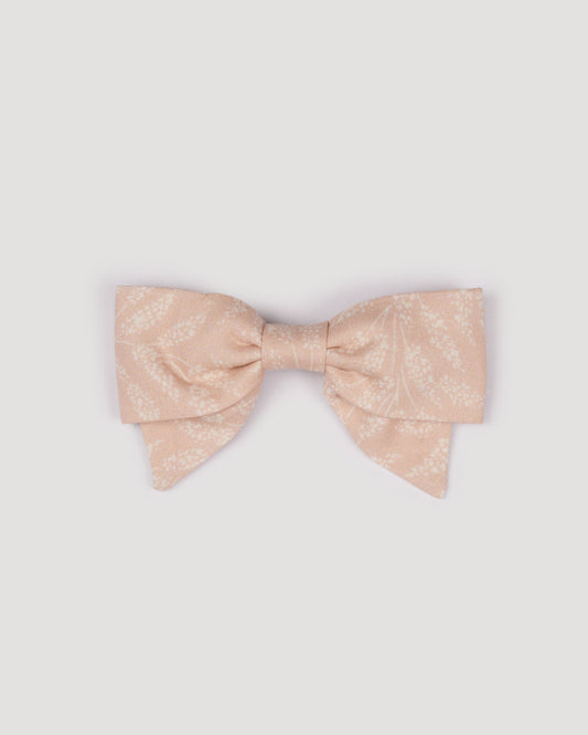 Early Sunday, Chiara Clip in Feather print, made from Printed 60s Cotton Cambric fabric, featuring a bow design on an alligator clip with a secure fit, shown in a front flat-lay view