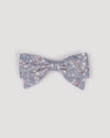 Early Sunday, Chiara Clip in Celestial print, made from Printed 60s Cotton Satin fabric, featuring a bow design on an alligator clip with a secure fit, shown in a front flat-lay view