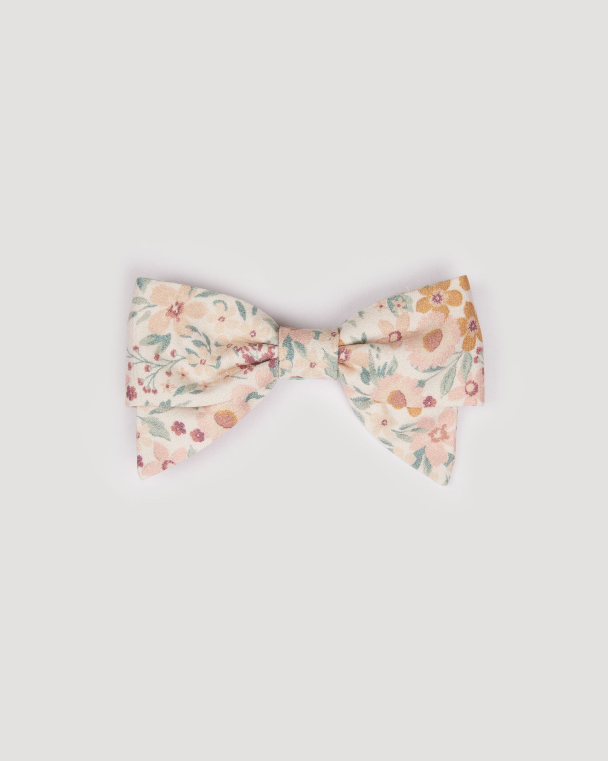 Early Sunday, Chiara Clip in Floral print, made from Printed 60s Cotton Satin fabric, featuring a bow design on an alligator clip with a secure fit, shown in a front flat-lay view