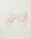 Early Sunday, Chiara Clip in Painted Bouquet print, made from Printed 70% Cotton, 30% Linen fabric, featuring a bow design on an alligator clip with a secure fit, shown in a front flat-lay view