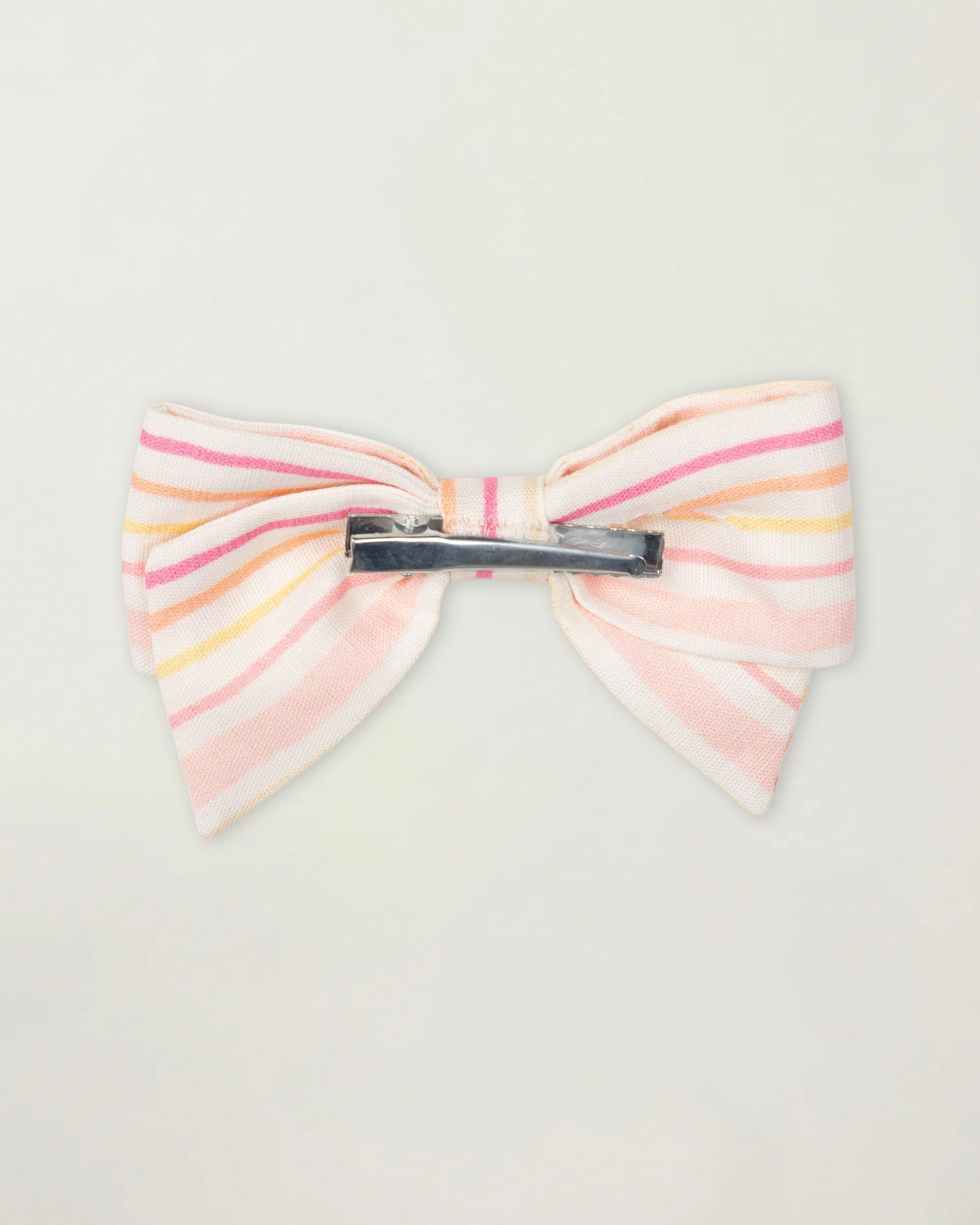 Early Sunday, Chiara Clip in Pink Stripes print, made from Printed 70% Cotton, 30% Linen fabric, featuring a bow design on an alligator clip with a secure fit, shown in a back flat-lay view