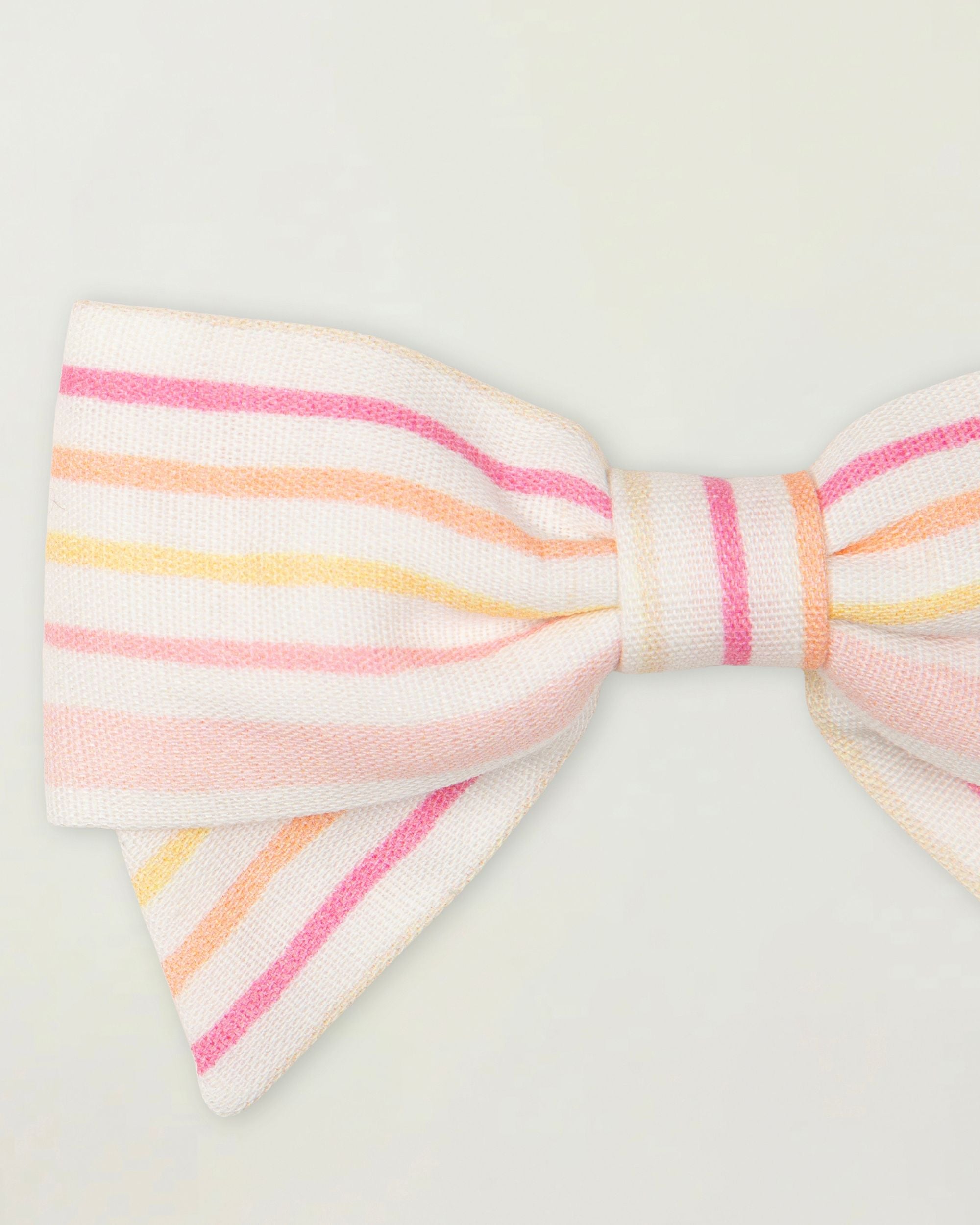 Early Sunday, Chiara Clip in Pink Stripes print, made from Printed 70% Cotton, 30% Linen fabric, featuring a bow design on an alligator clip with a secure fit, shown in a closeup flat-lay view