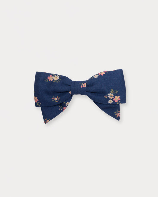 Early Sunday, Chiara Clip in Ditsy Bouquet Navy Blue, made from Printed Cotton Satin fabric, featuring a bow design on an alligator clip with a secure fit, shown in a front flat-lay view