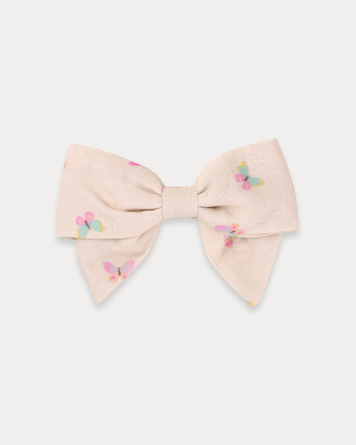 Early Sunday, Chiara Clip in Butterflies print, made from Printed Cotton Tiny Swiss Dobby fabric, featuring a bow design on an alligator clip with a secure fit, shown in a front flat-lay view