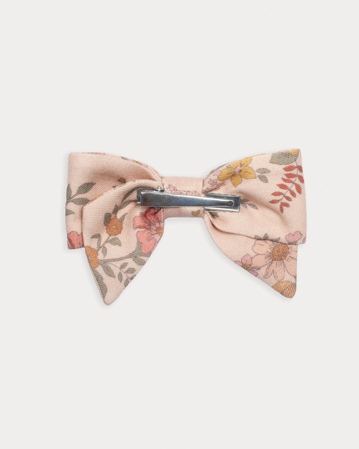 Early Sunday, Chiara Clip in Bloom Blush, made from Printed Viscose Twill fabric, featuring a bow design on an alligator clip with a secure fit, shown in a back flat-lay view