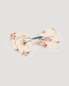 Early Sunday, Chiara Clip in Ditsy Bouquet Cream print, made from Printed Viscose Twill fabric, featuring a bow design on an alligator clip with a secure fit, shown in a back flat-lay view