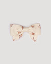 Early Sunday, Chiara Clip in Ditsy Bouquet Cream print, made from Printed Viscose Twill fabric, featuring a bow design on an alligator clip with a secure fit, shown in a front flat-lay view