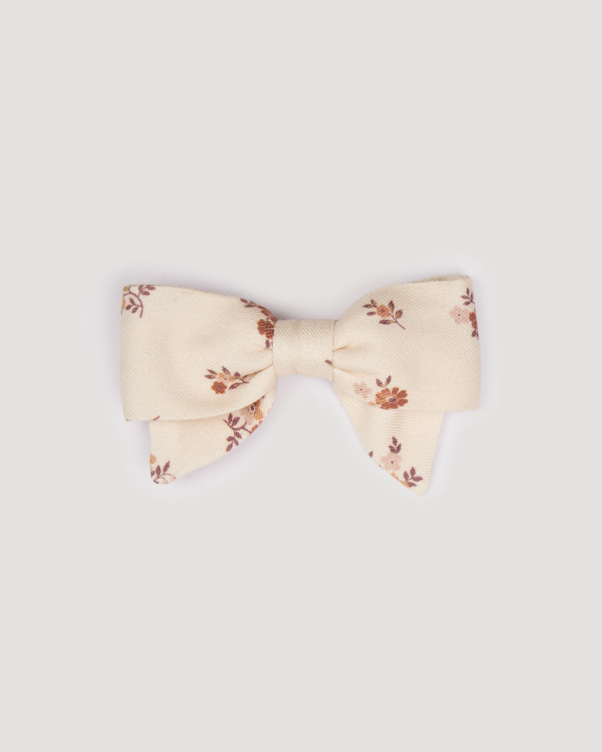 Early Sunday, Chiara Clip in Ditsy Bouquet Cream print, made from Printed Viscose Twill fabric, featuring a bow design on an alligator clip with a secure fit, shown in a front flat-lay view