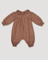 Early Sunday, Coco Baby Romper in Bark color, made from All-over Embroidered 30s Cotton Brushed Twill fabric, featuring ruffled neckline with leaf prints, shown in a back flat-lay view