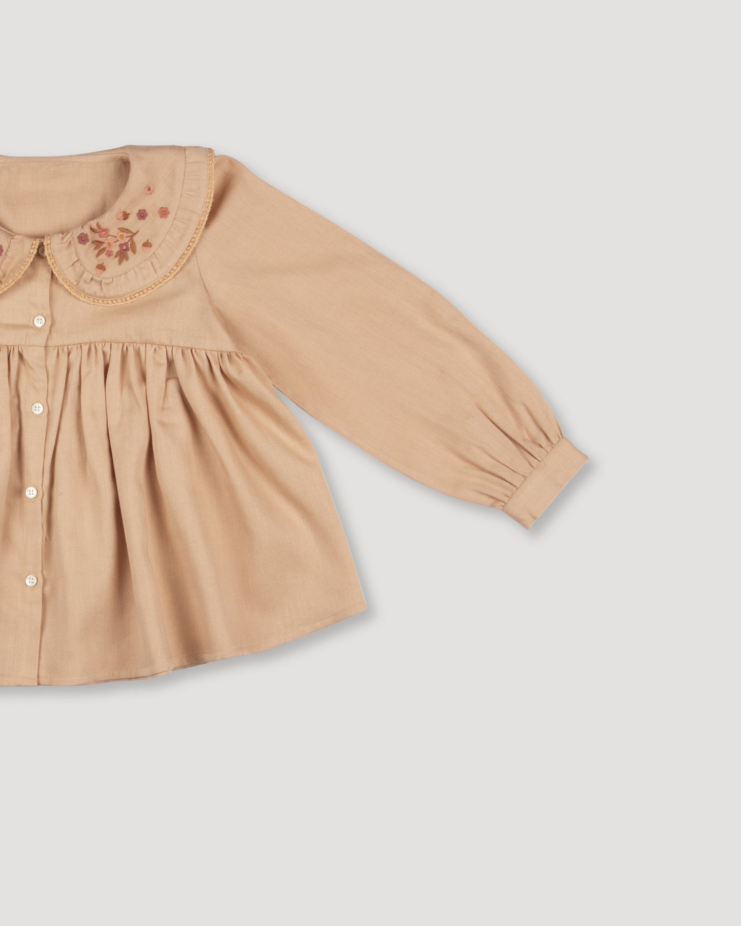 Early Sunday, Colette Blouse in Beige, made from Cotton Satin fabric, featuring relaxed fit, classic collar, and button-down front, shown in a closeup flat-lay view