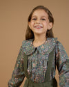Early Sunday, Colette Blouse in Autumn Garden Greyish Blue, made from Printed Cotton Satin fabric, featuring relaxed fit, classic collar, and button-down front, shown in a close-up side view of a model wearing it
