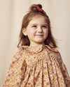 Early Sunday, Colette Blouse in Garden Flowers Dusty Pink, made from Printed Cotton Satin fabric, featuring relaxed fit, classic collar, and button-down front, shown in a front view of model wearing it