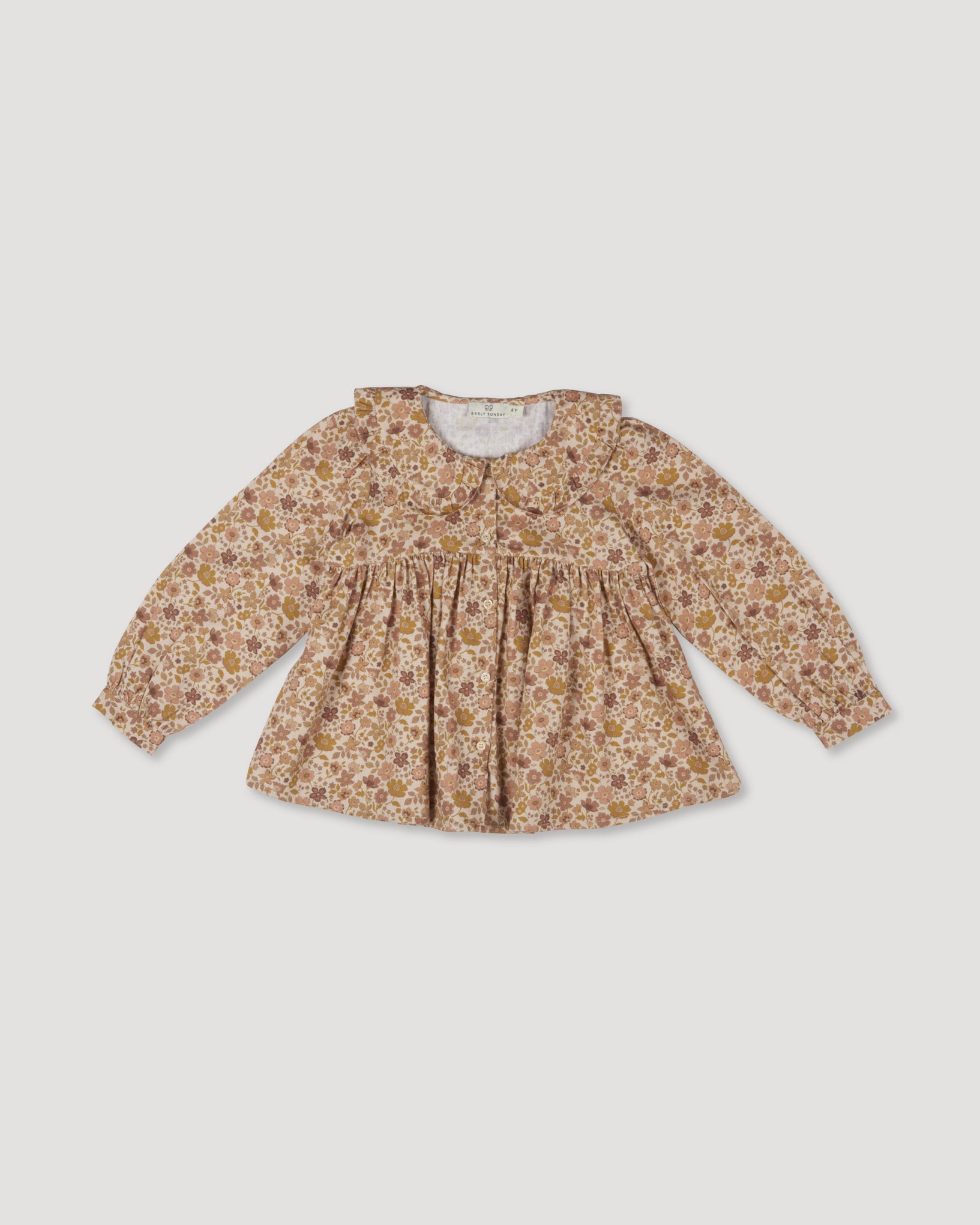 Early Sunday, Colette Blouse in Garden Flowers Dusty Pink, made from Printed Cotton Satin fabric, featuring relaxed fit, classic collar, and button-down front, shown in a front flat-lay view