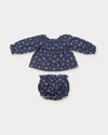 Early Sunday, Daisy Baby Blouse & Bloomer Set in Ditsy Bouquet Navy, made from Printed Cotton Satin fabric, featuring a frilly neckline with detailed lace yoke & gathered sleeves, shown in a front flat-lay view