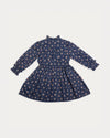 Early Sunday, Dawn Dress in Ditsy Bouquet Navy, made from Printed Cotton Satin fabric, featuring a soft flowing hem, shown in a back flat-lay view