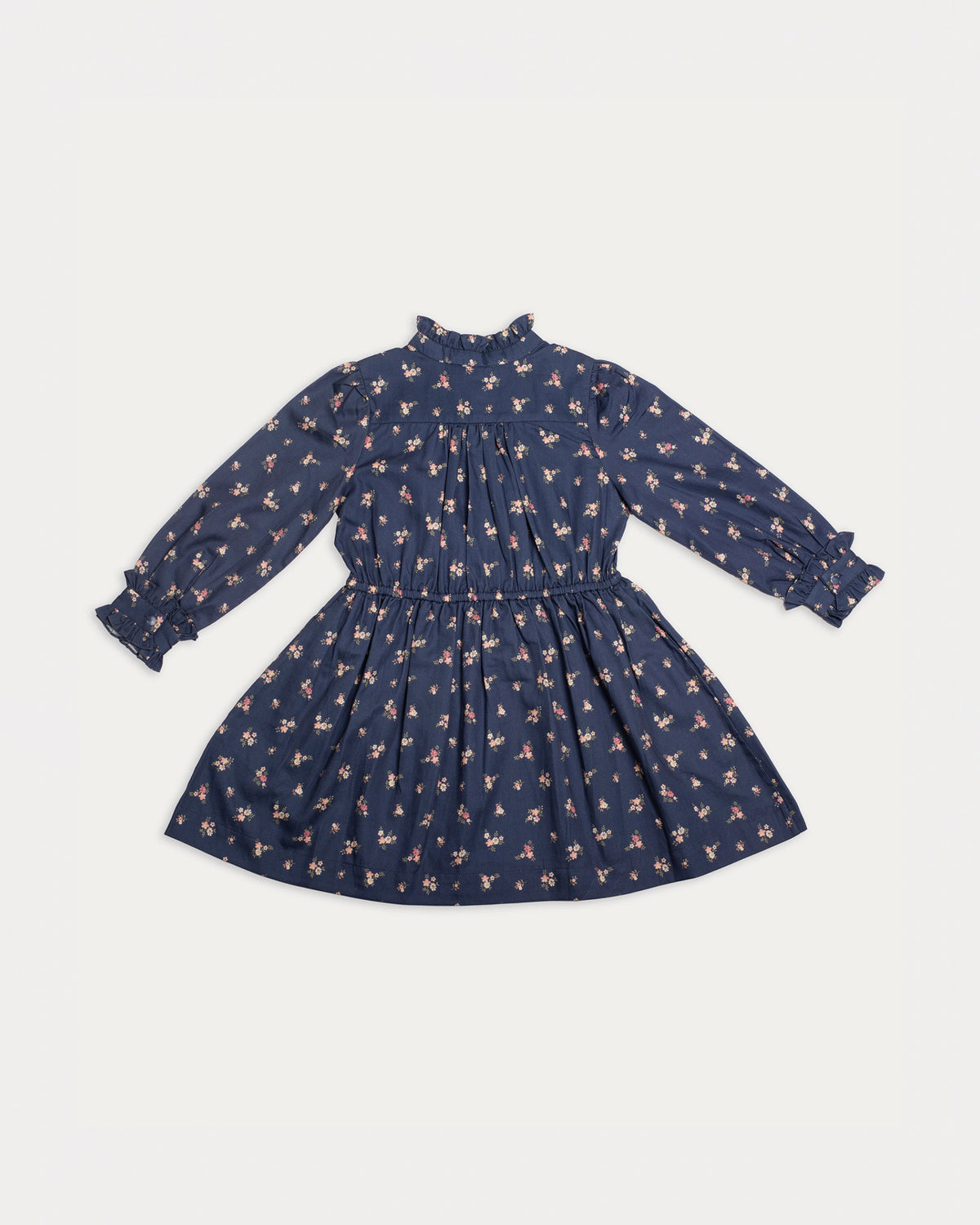 Early Sunday, Dawn Dress in Ditsy Bouquet Navy, made from Printed Cotton Satin fabric, featuring a soft flowing hem, shown in a back flat-lay view