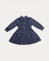 Early Sunday, Dawn Dress in Ditsy Bouquet Navy, made from Printed Cotton Satin fabric, featuring a soft flowing hem, shown in a front flat-lay view