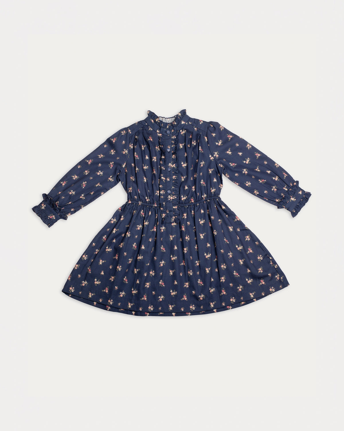 Early Sunday, Dawn Dress in Ditsy Bouquet Navy, made from Printed Cotton Satin fabric, featuring a soft flowing hem, shown in a front flat-lay view