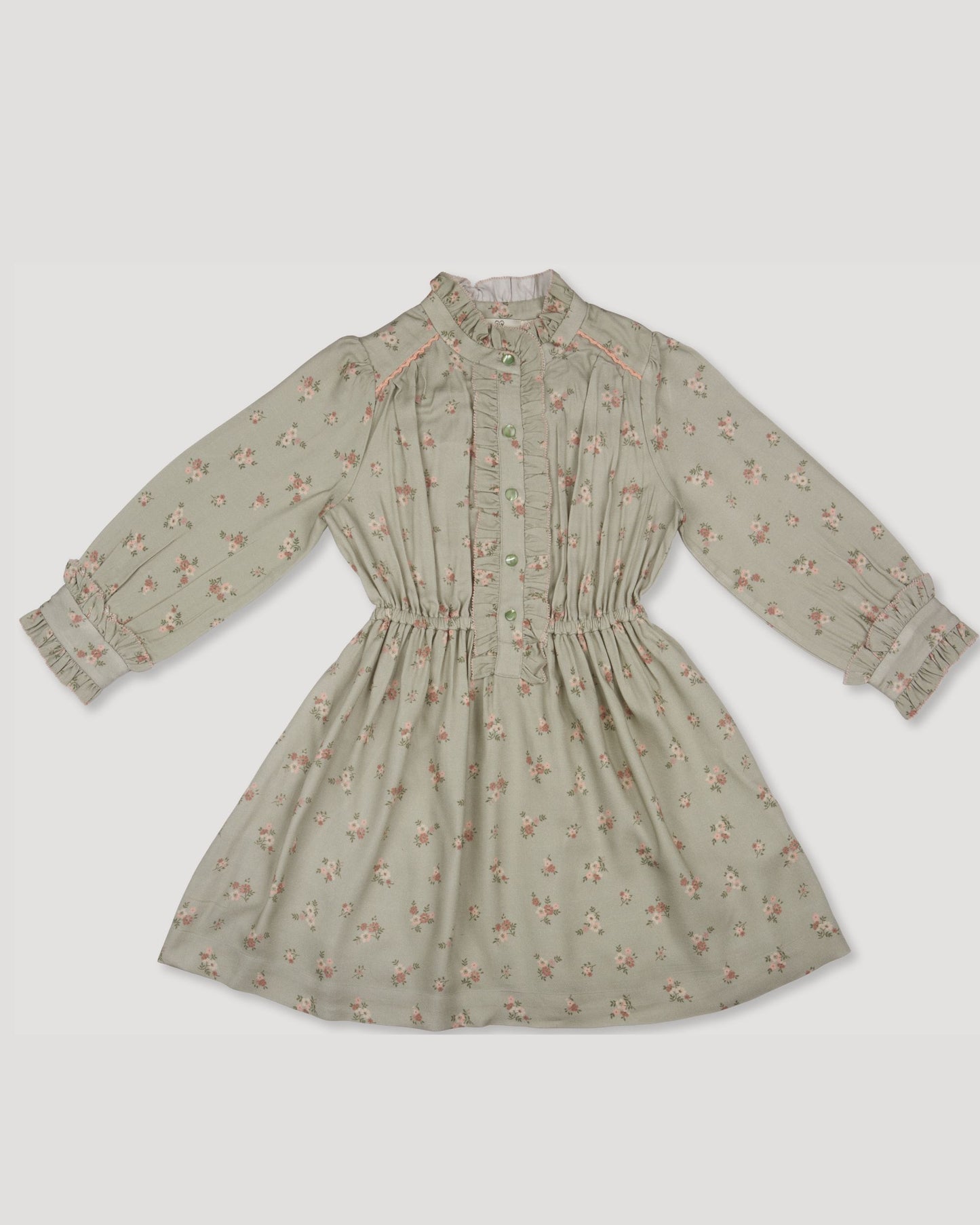 Early Sunday, Dawn Dress in Ditsy Bouquet Jade print, made from Printed Viscose Rayon Twill fabric, featuring Collar and sleeve cuffs trimmed with subtle ruffles for a nostalgic silhouette, shown in a front flat-lay view