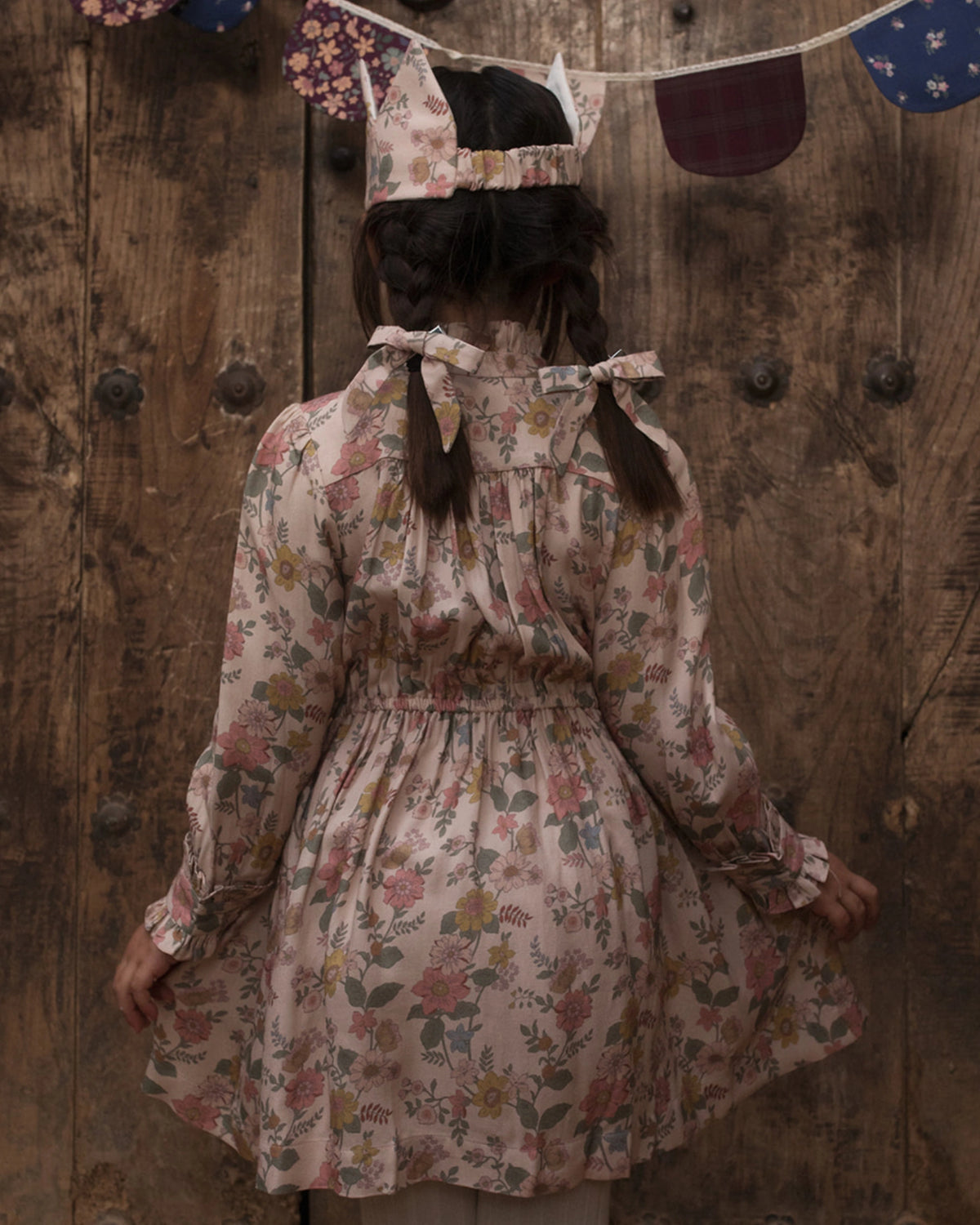 Early Sunday, Dawn Dress in Bloom, made from Printed Viscose Twill fabric, featuring a soft flowing hem, shown in a back view of model wearing it