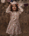 Early Sunday, Dawn Dress in Bloom, made from Printed Viscose Twill fabric, featuring a soft flowing hem, shown in a front view of model wearing it