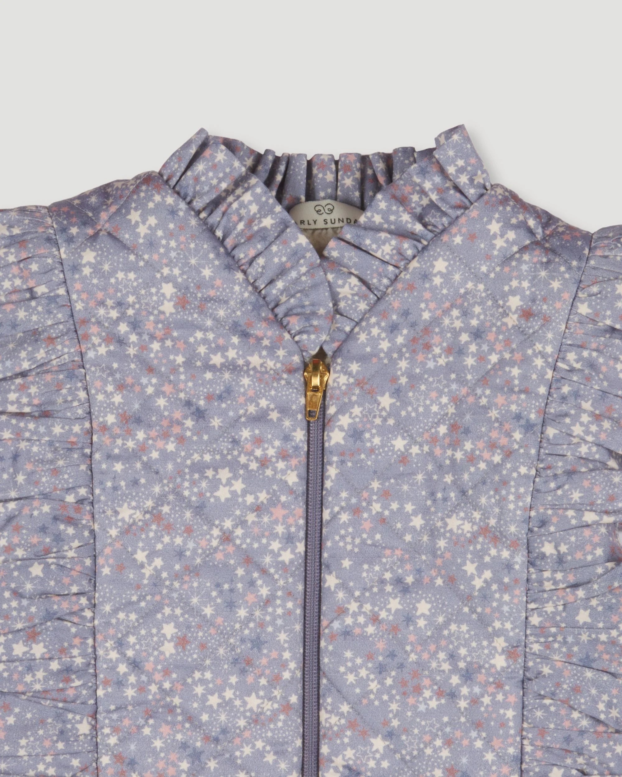 Early Sunday, Deborah Jacket in Celestial print, made from Printed 30s Cotton Twill fabric, featuring Sleeveless design ideal for versatile layering in transitional weather, shown in a closeup flat-lay view