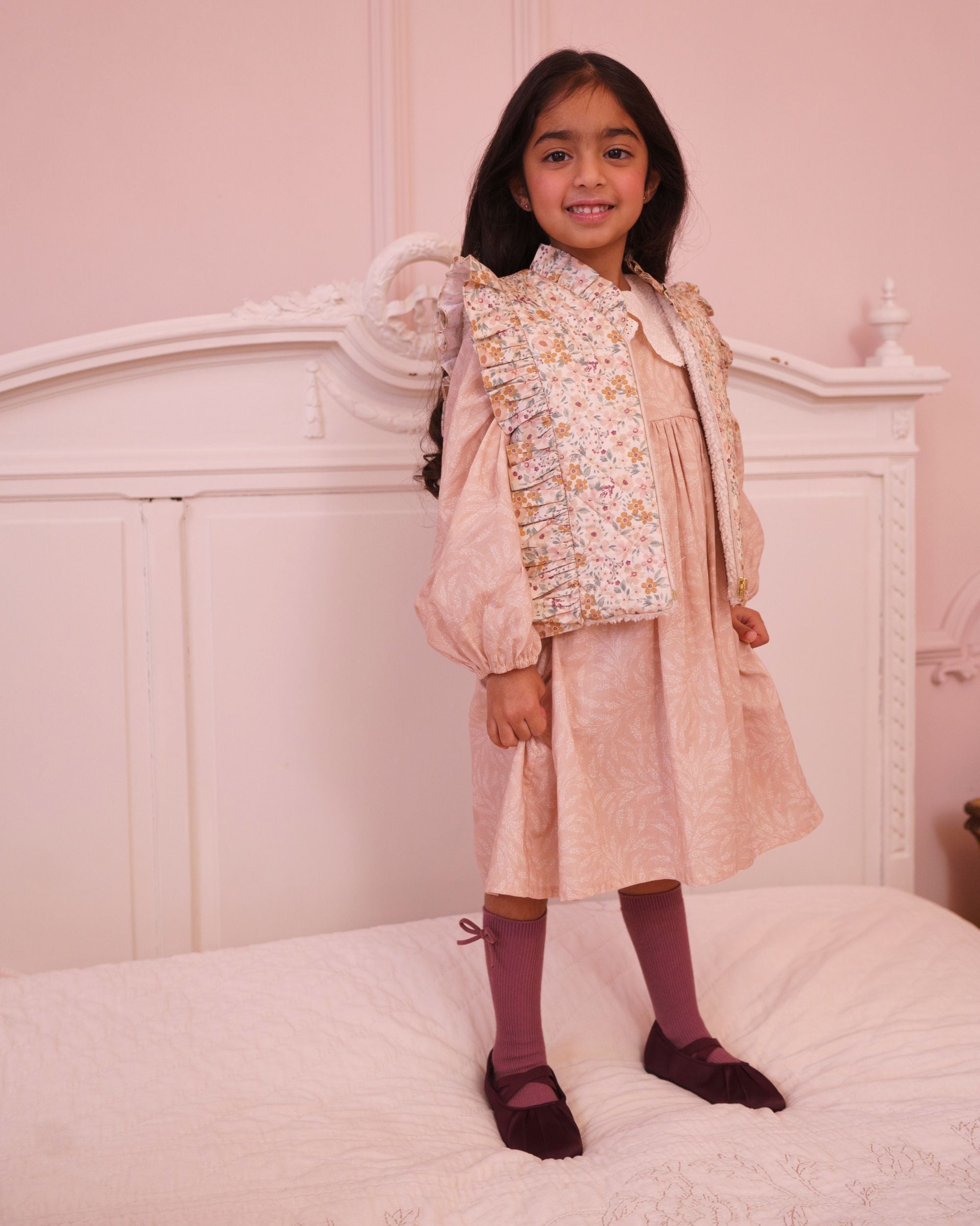Early Sunday, Deborah Jacket in Floral print, made from Printed 30s Cotton Twill fabric, featuring Sleeveless design ideal for versatile layering in transitional weather, shown in a front view of model wearing it