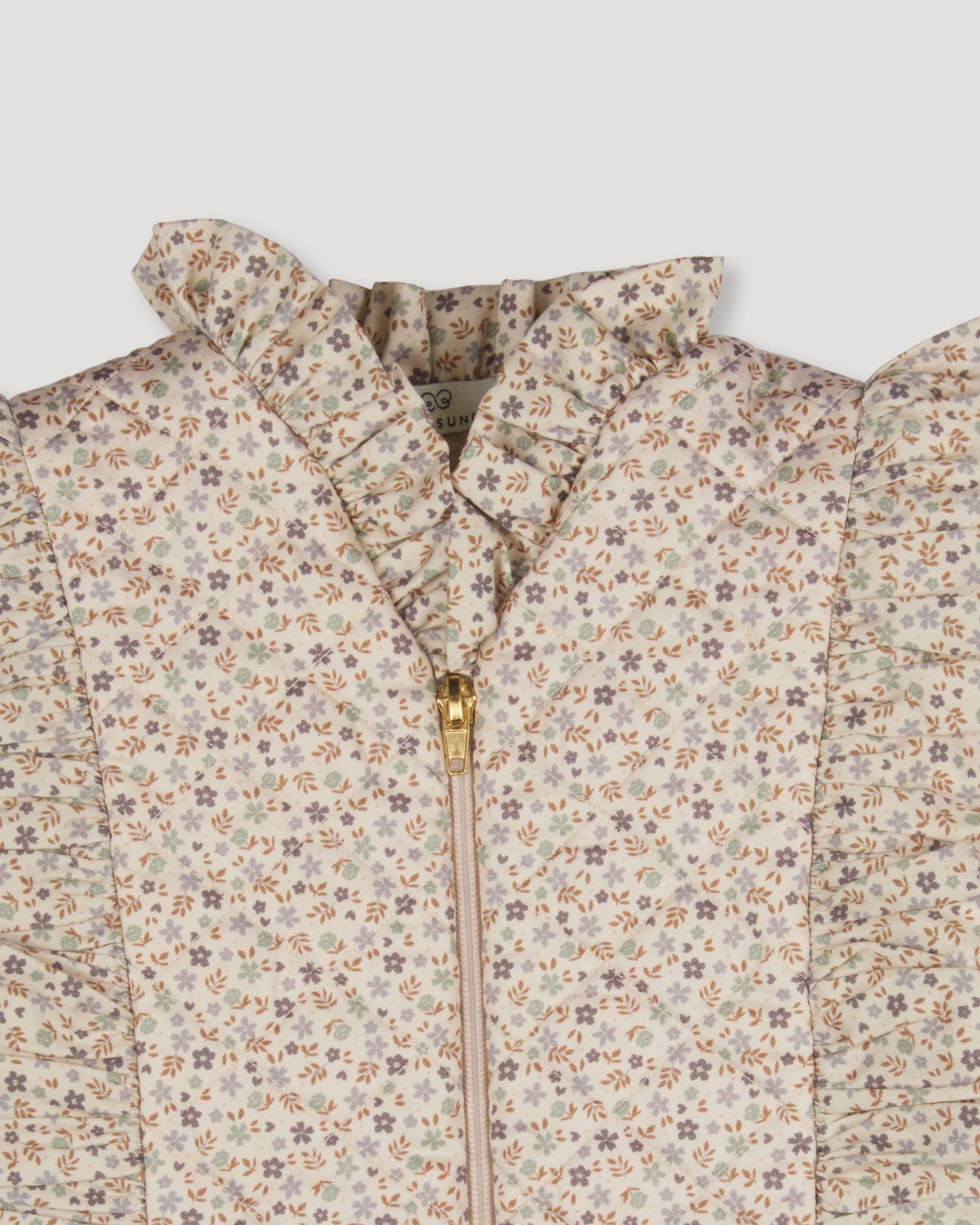 Early Sunday, Deborah Jacket in Miny Flowers print, made from Printed 30s Cotton Twill fabric, featuring Sleeveless design ideal for versatile layering in transitional weather, shown in a closeup flat-lay view
