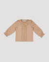 Early Sunday, Ella Blouse in Nude, made from Cotton Cambric fabric, featuring relaxed fit, frill detailing on the collar, and lace inserts, shown in a front flat-lay view