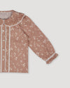 Early Sunday, Ella Blouse in Fawn Soft Pinkish Brown, made from Printed Cotton Cambric fabric, featuring relaxed fit, frill detailing on the collar, and lace inserts, shown in closeup flat-lay view