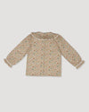 Early Sunday, Ella Blouse in Garden Flowers Cream, made from Printed Cotton Cambric fabric, featuring relaxed fit, frill detailing on the collar, and lace inserts, shown in a back flat-lay view
