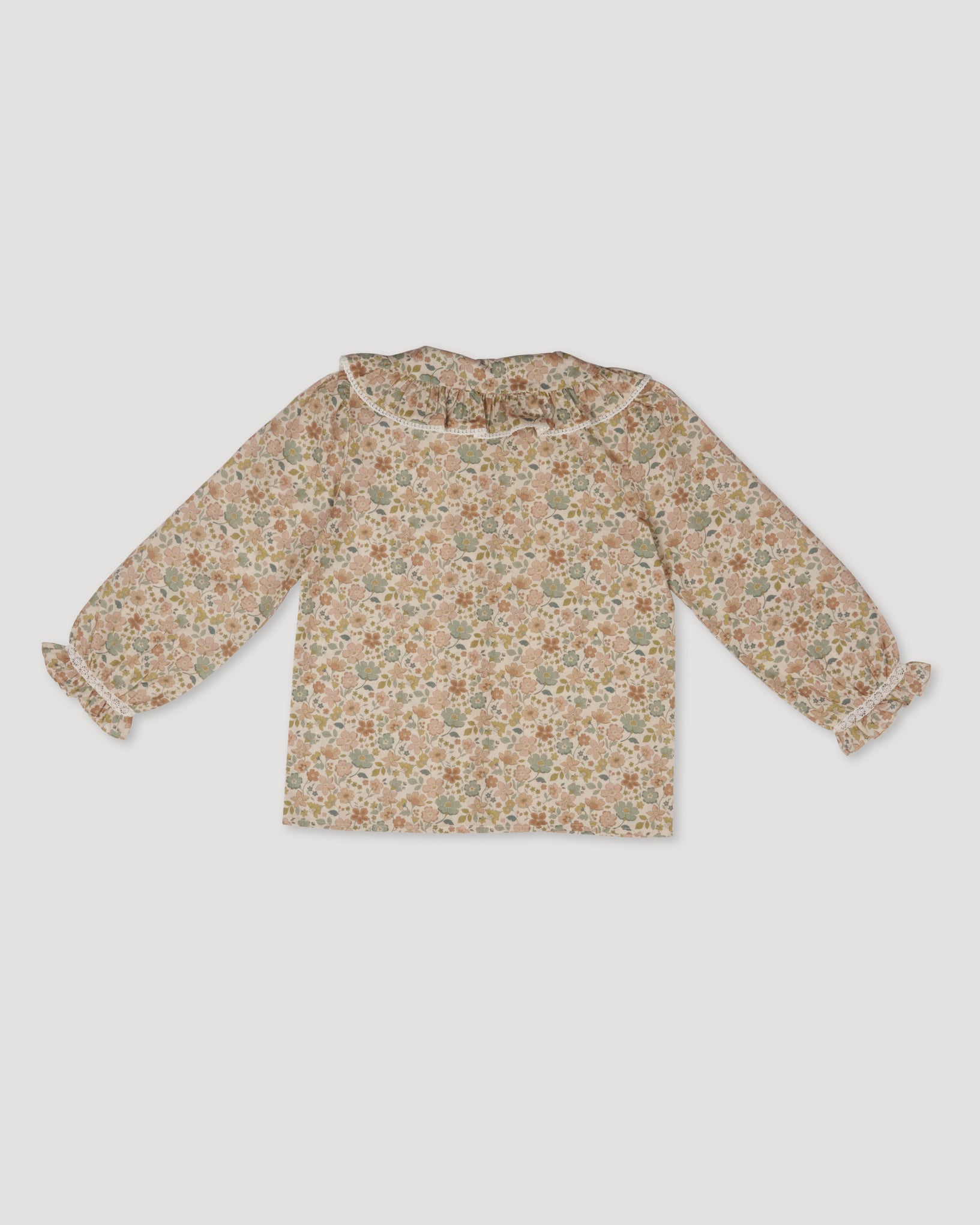 Early Sunday, Ella Blouse in Garden Flowers Cream, made from Printed Cotton Cambric fabric, featuring relaxed fit, frill detailing on the collar, and lace inserts, shown in a back flat-lay view
