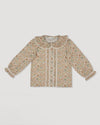 Early Sunday, Ella Blouse in Garden Flowers Cream, made from Printed Cotton Cambric fabric, featuring relaxed fit, frill detailing on the collar, and lace inserts, shown in a front flat-lay view
