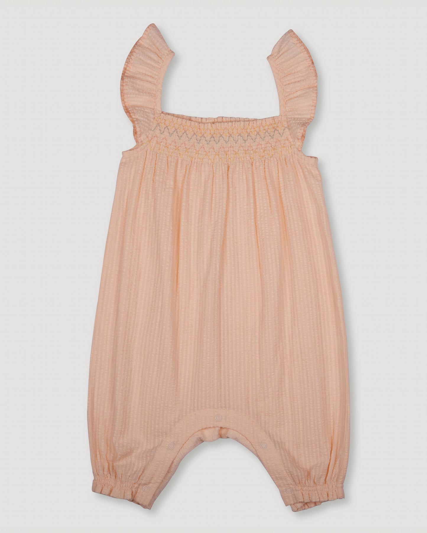 Early Sunday, Emma Baby Smocked Overalls Romper in Warm Sand color, made from Cotton Seersucker fabric, featuring a relaxed fit with smocked chest band & frilled sleeves, shown in a back flat-lay view
