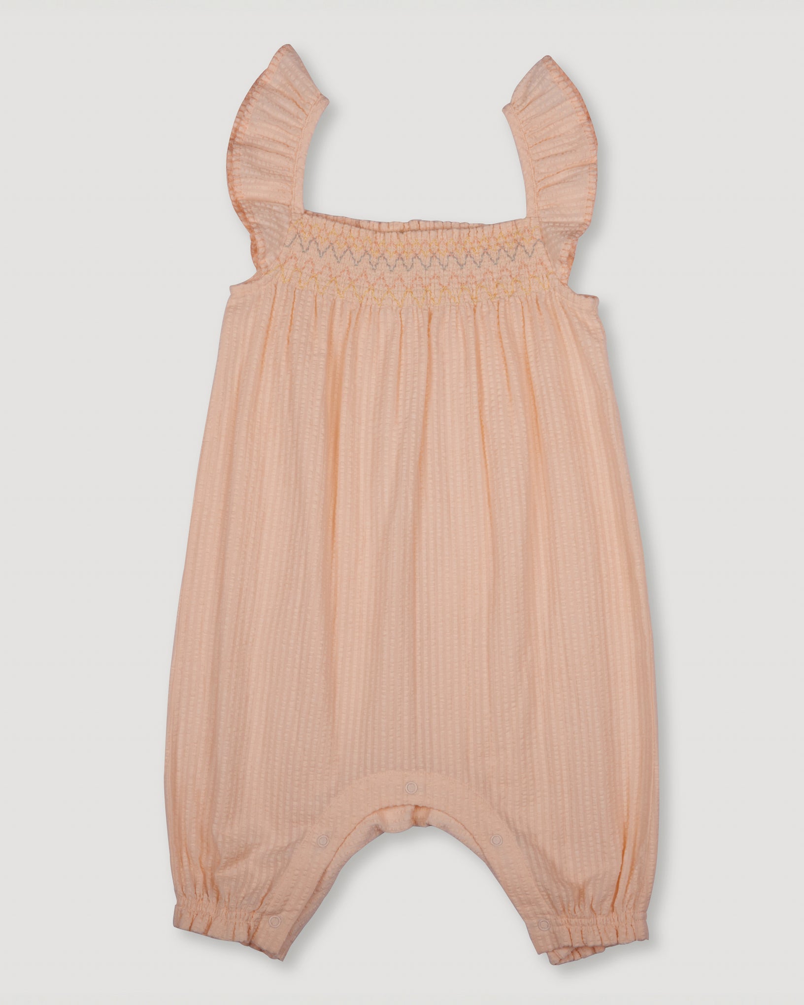 Early Sunday, Emma Baby Smocked Overalls Romper in Warm Sand color, made from Cotton Seersucker fabric, featuring a relaxed fit with smocked chest band & frilled sleeves, shown in a back flat-lay view