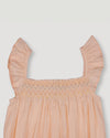 Early Sunday, Emma Baby Smocked Overalls Romper in Warm Sand color, made from Cotton Seersucker fabric, featuring a relaxed fit with smocked chest band & frilled sleeves, shown in a closeup flat-lay view