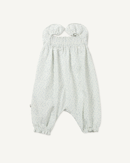 Early Sunday, Emma Baby Smocked Overalls Romper in Mini Flower print, made from Printed canvas 70% Cotton 30% Linen fabric, featuring a relaxed fit with smocked chest band & frilled sleeves, shown in a front flat-lay view