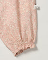 Early Sunday, Emma Baby Smocked Overalls Romper in Garden Flowers print, made from Printed Cotton Cambric fabric, featuring a relaxed fit with smocked chest band & frilled sleeves, shown in a closeup flat-lay view