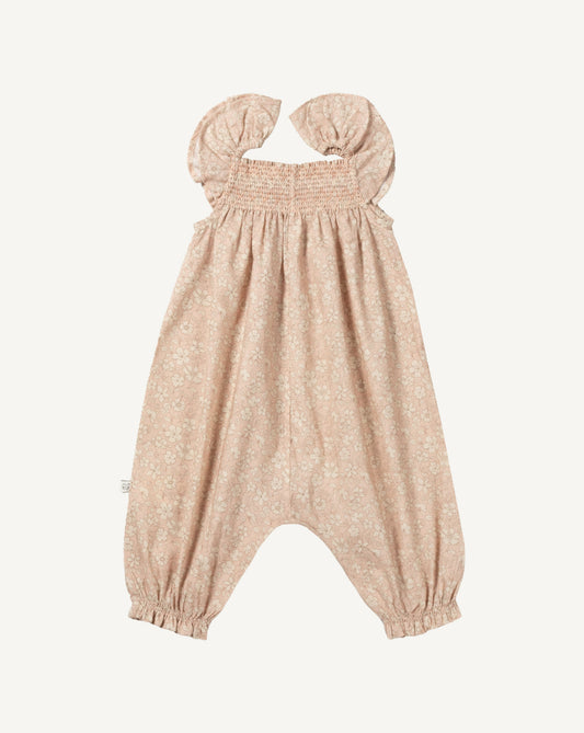 Early Sunday, Emma Baby Smocked Overalls Romper in Garden Flowers print, made from Printed Cotton Cambric fabric, featuring a relaxed fit with smocked chest band & frilled sleeves, shown in a front flat-lay view