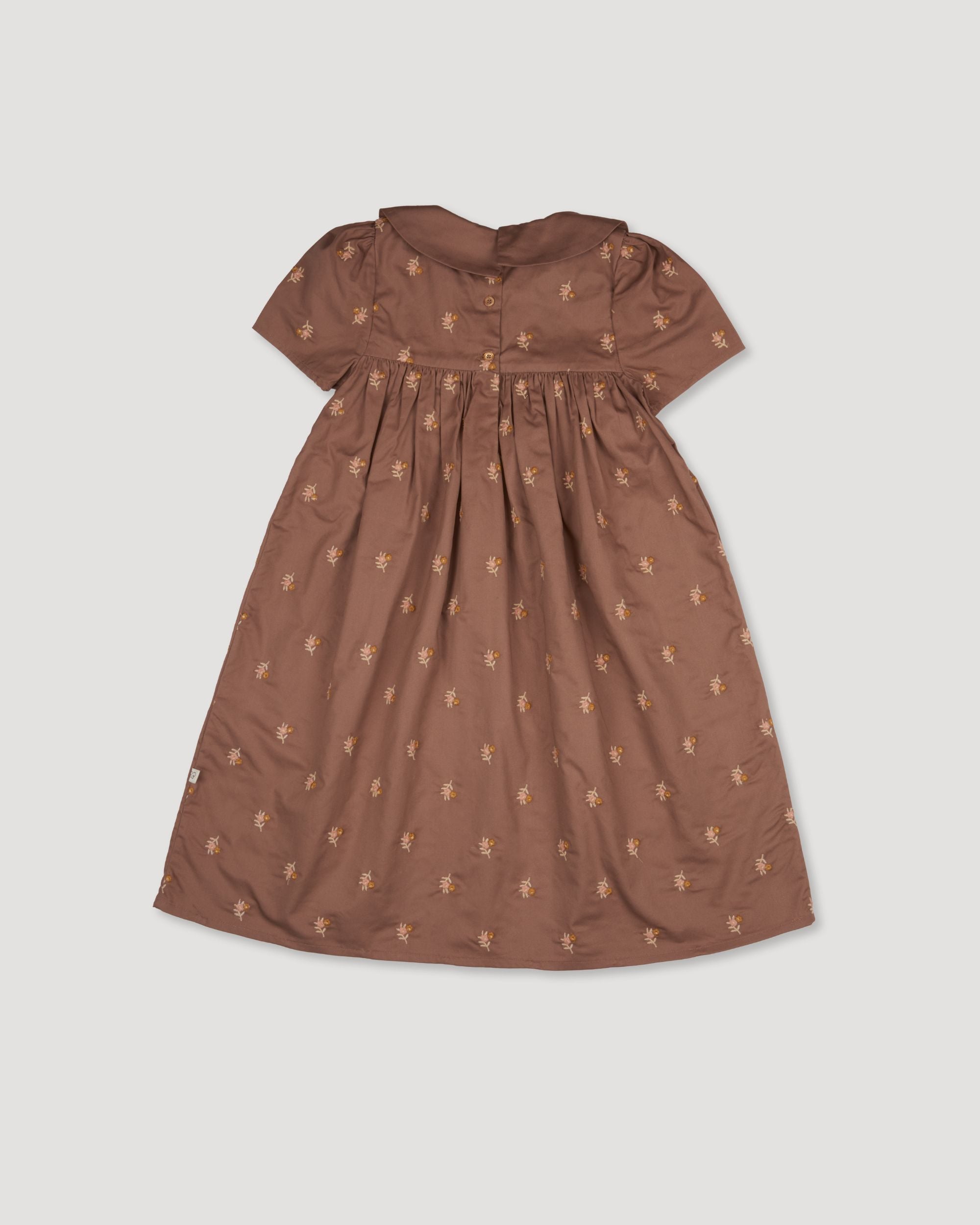Early Sunday, Erika Dress in Bark, made from All-Over Embroidered 30s Cotton Brushed Twill fabric, featuring Flowy A-line silhouette allows ease of movement and day-long comfort, shown in a back flat-lay view