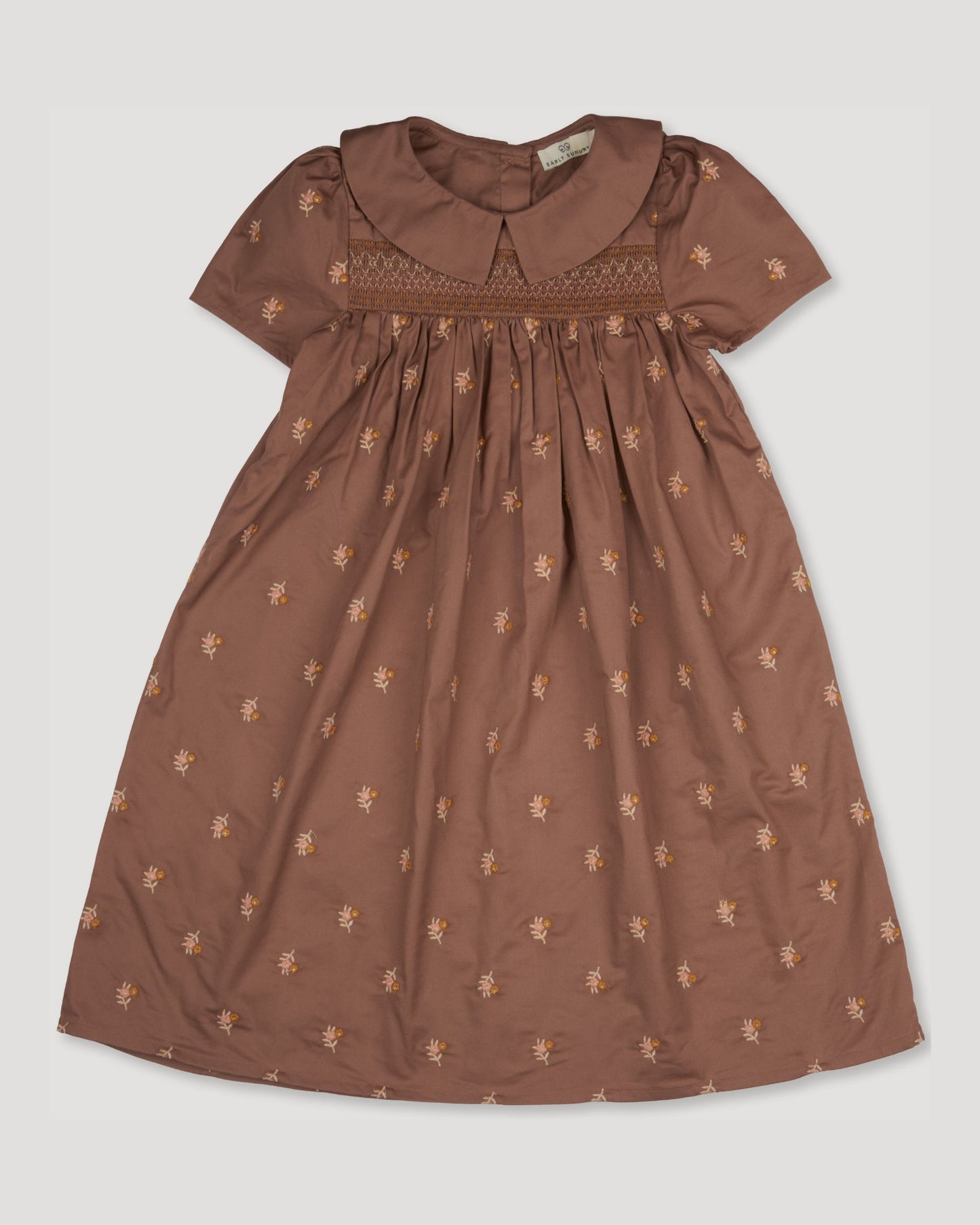 Early Sunday, Erika Dress in Bark, made from All-Over Embroidered 30s Cotton Brushed Twill fabric, featuring Flowy A-line silhouette allows ease of movement and day-long comfort, shown in a front flat-lay view
